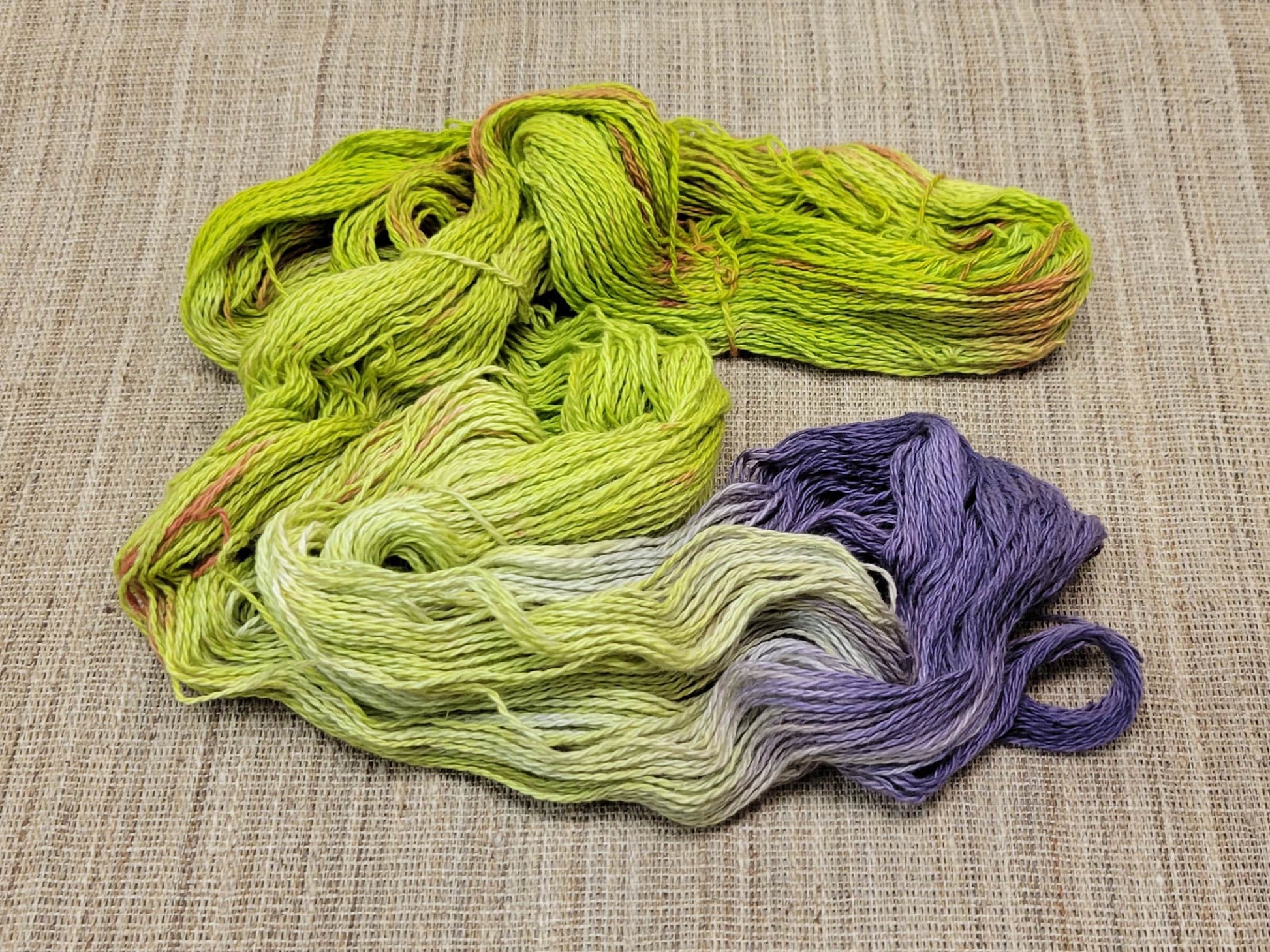 Dyed Cotton / Linen Blend Yarn. Purple, Orange and Green. Fingering Weight. Great for knitting, crochet, and weaving. Assigned Pooling.