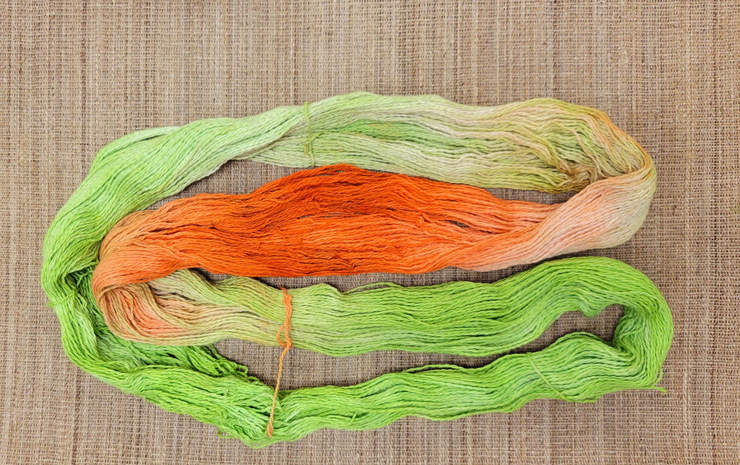 Dyed Cotton / Linen Blend Yarn. Green and Orange. Fingering Weight. Great for knitting, crochet, and weaving. Great for Assigned Pooling.