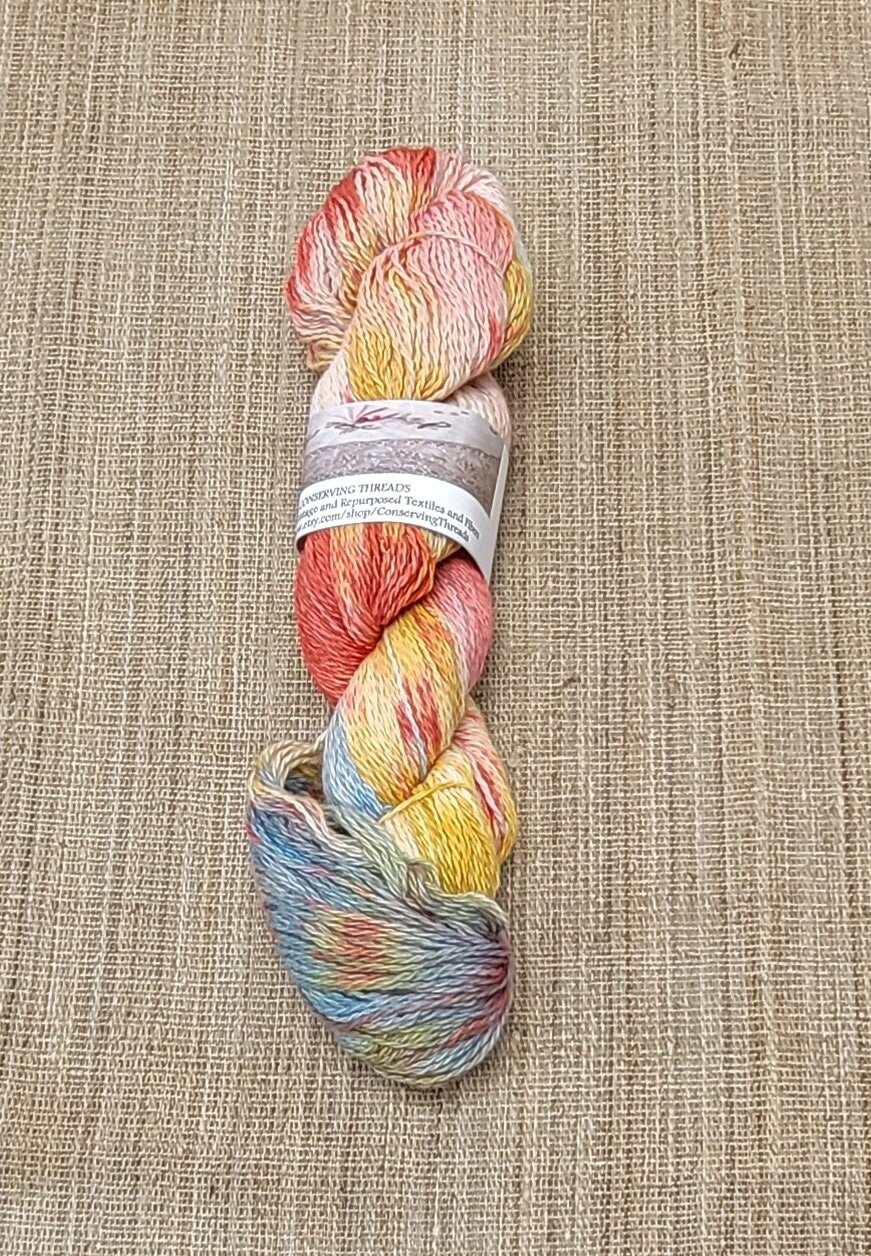 Dyed Cotton / Linen Blend Yarn. Red, Blue, Yellow and White. Fingering Weight. Great for knitting, crochet, and weaving. Assigned Pooling.