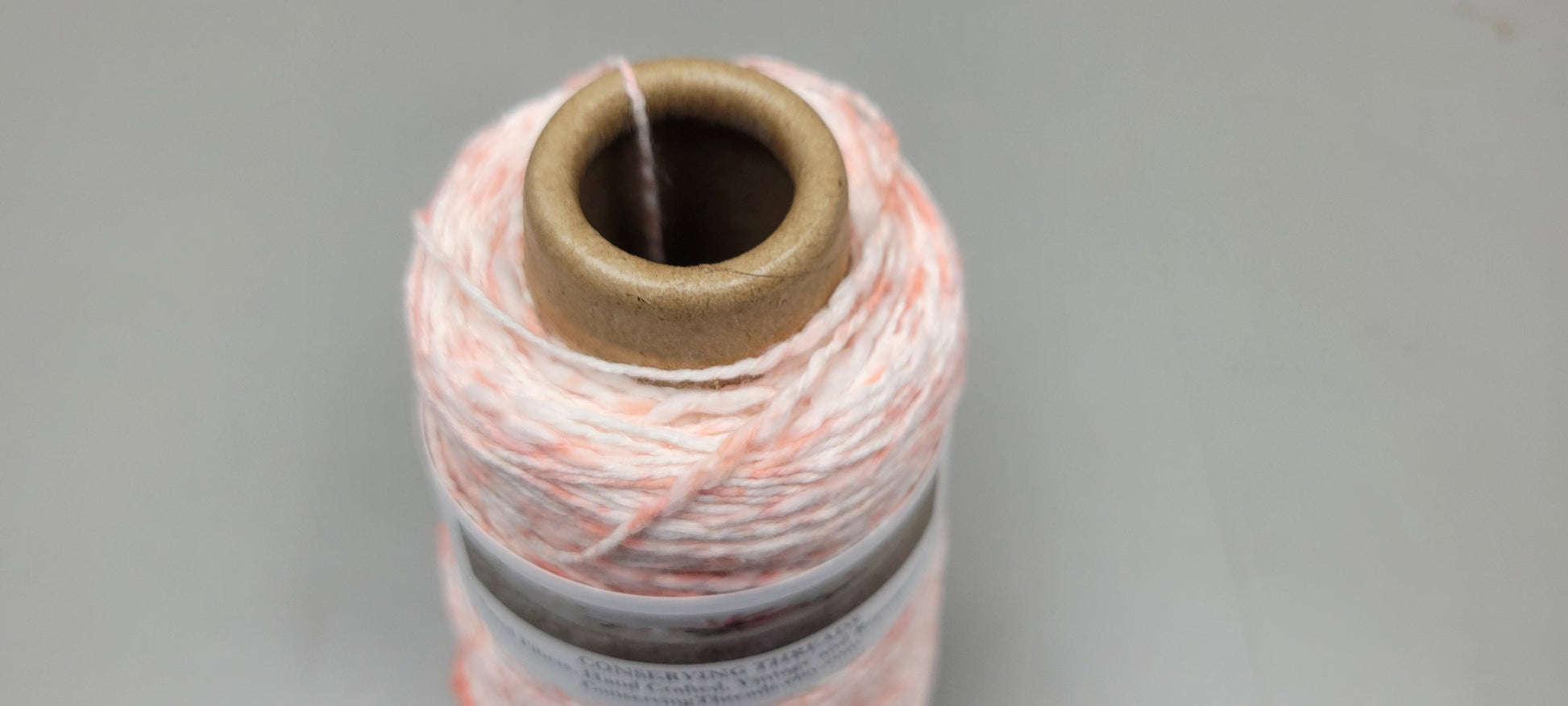 Cotton Yarn Splatter Light Red and White, Hand Spun, 2 Ply Fingering Weight on Cone. Great for Knitting, Crochet, Weaving, Big Stitching